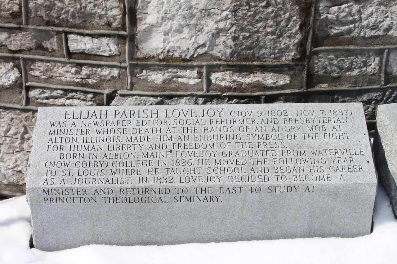 First Block of Elijah Lovejoy's story to the left of the monument after you climb the steps.