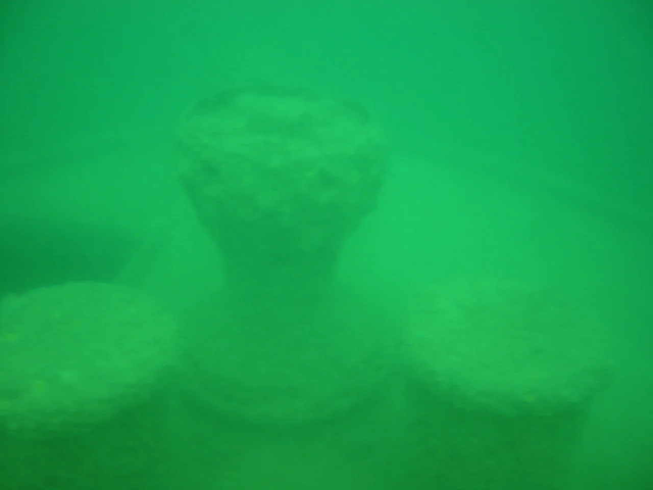 Three capstans on the stern end of the w:en:Thomas Wilson (shipwreck), a ship wrecked in the harbor of Duluth, Minnesota.