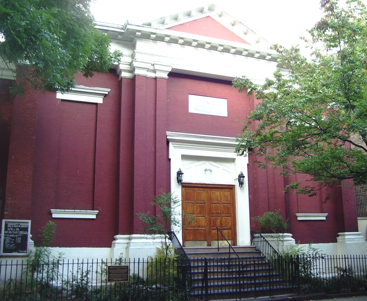 The Community Synagogue Max D. Raiskin Center at 323 East 6th Street between First and Second Avenues in the East Village, Manhattan, New York City was built c.1847 in the Greek Revival style. Until 1940 it was a branch of German St. Matthew's Lutheran Evangelical Church, a mostly German immigrant parish.  On June 15, 1904 1,200 parishioners and friends were killed when the PS General Slocum caught fire and sank in the East River.  The building was sold to the newly-formed Community Synagogue in 1940.  It is located within the East Village/Lower East Side Historic District (Sources: "East Village/Lower East Side Historic District Designation Report", AIA Guide to NYC (4th ed.) and historical plaque on the fence of the building)